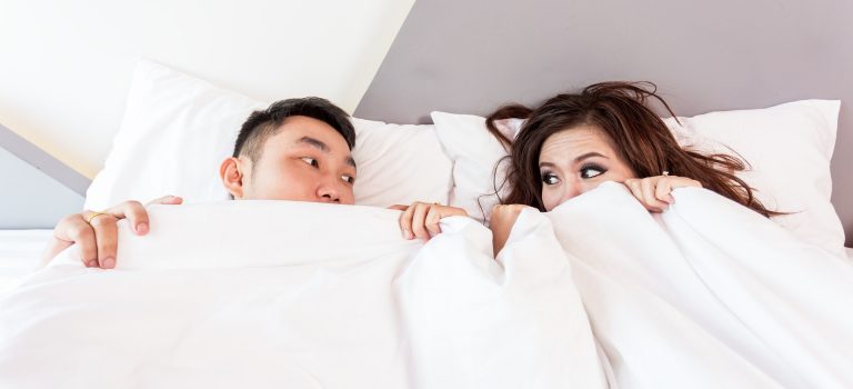 couple in bed depicting sexless marriage
